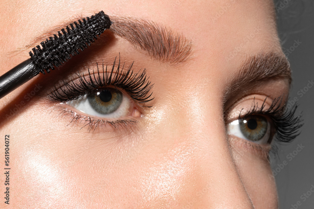 Naklejka premium Close-up of make-up blue eye with long lashes with black mascara