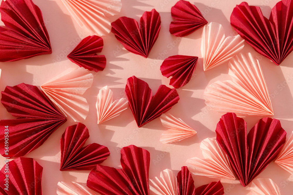 Obraz premium Valentines day flat lay. Stylish pink and red hearts composition on pink paper background. Happy Valentine's day! Modern cute valentine hearts cutouts. Creative love background