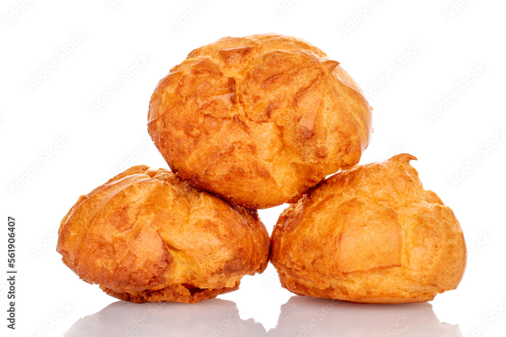 Several fresh fragrant chouquettes, on a white background. Several fresh fragrant chouquettes, on a white background.