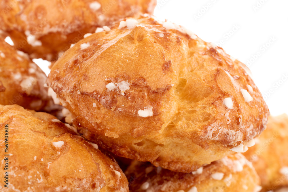 Several sweet chouquettes, close-up, isolated on white. Several sweet chouquettes, close-up, isolated on white.