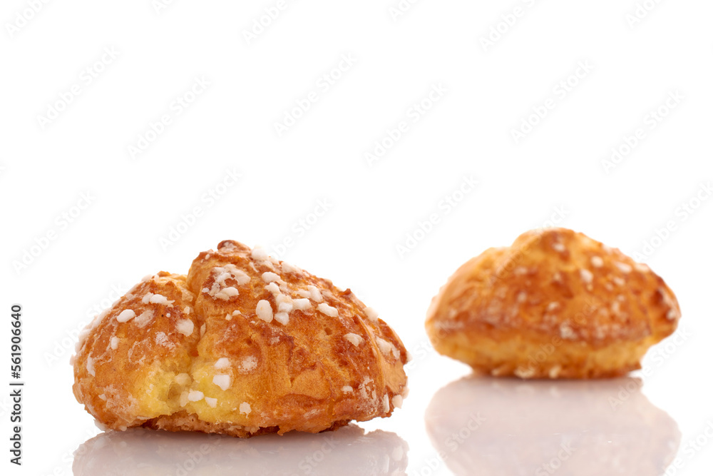Two sweet chouquette, close-up, isolated on white.