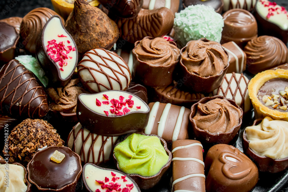 Chocolate candies with nuts and various fillings. Chocolate candies with nuts and various fillings.