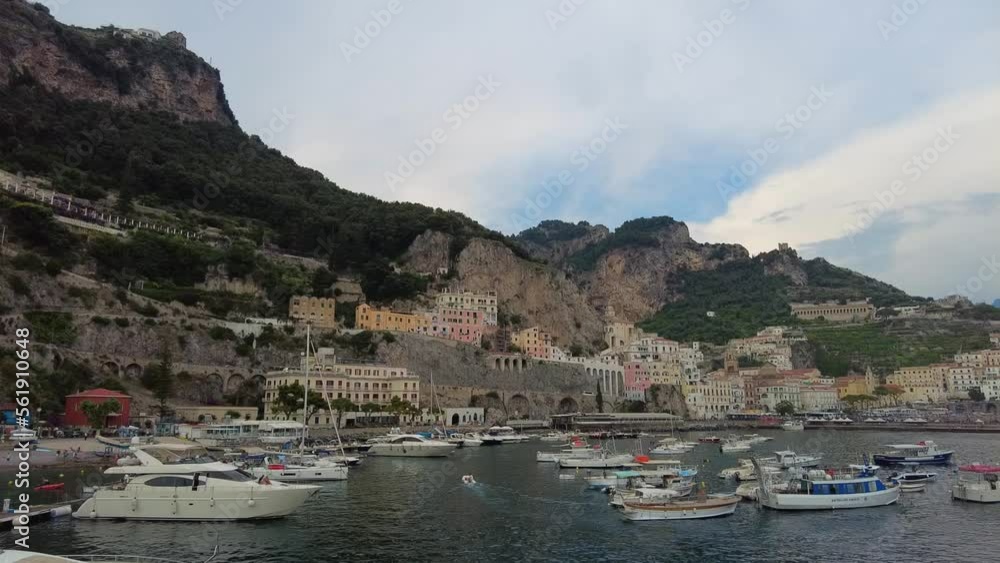 Positano, tourist destination on the Amalfi Coast, Historic White town along the Amalfi Coast Near Salerno. Aerial view of the famous tourist resort of the Amalfi coast. Blue Ocean with boats. Positano, tourist destination on the Amalfi Coast, Historic White town along the Amalfi Coast Near Salerno. Aerial view of the famous tourist resort of the Amalfi coast. Blue Ocean with boats.