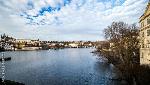 Taking a photograph in Karlov Bridge, Prague Bridges in the Summer on the Sunset. Czech Republic. Prague, Czech Republic. Panoramic cityscape image of famous Charles Bridge in Prague during beautiful  photo