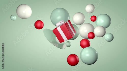 3d animation. A red gift box floats in the center among white and green balls of different sizes. Festive background or screensaver for congratulations.