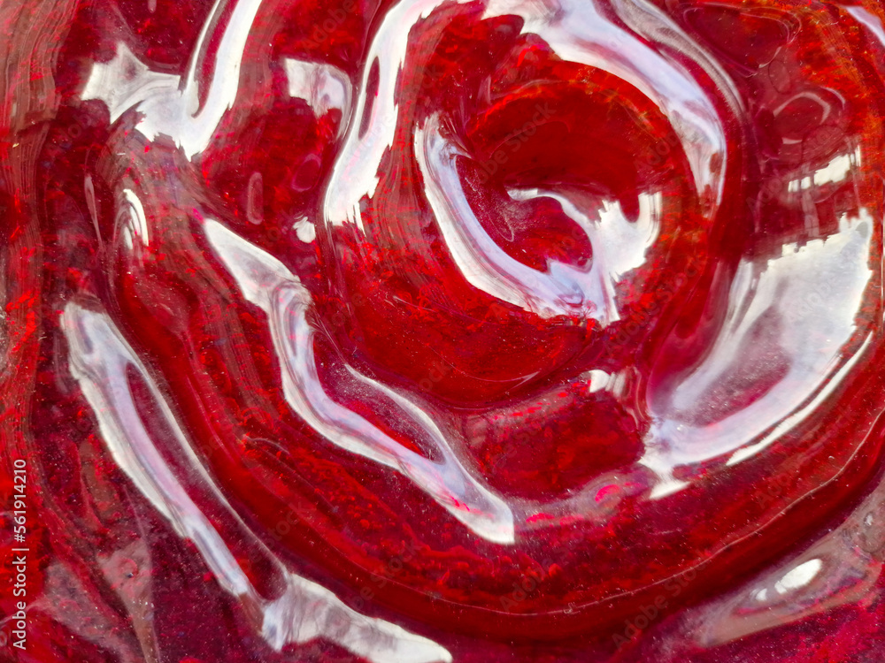 abstract glass texture. red glass background. glass in shape of a rose abstract glass texture. red glass background. glass in shape of a rose