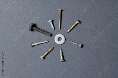 Top view of screws isolated on black paper background