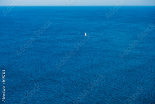 Calm and deep sea horizon seen from above, relaxation background.