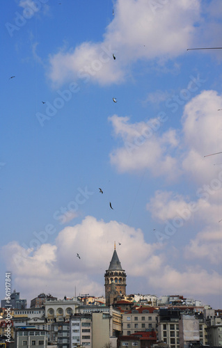 Daily life in the city. Fisherman`s fishes in front of The Galata Tower in Istanbul, Turkey.