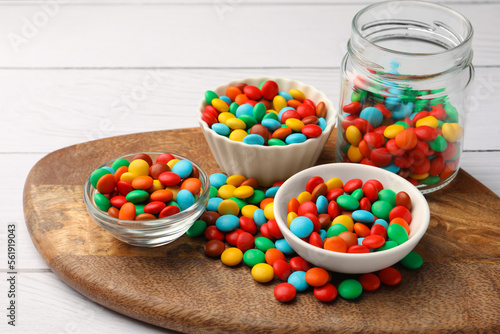 Canvas Print Tasty colorful candies on white wooden table