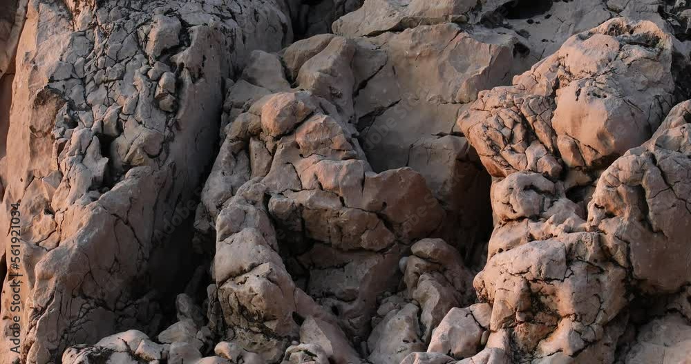 textural stone rocks on the shore of the adriatic sea at sunset. close-up textural stone rocks on the shore of the adriatic sea at sunset. close-up
