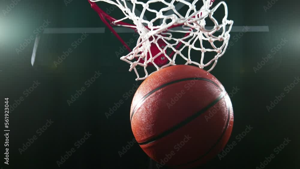 Super slow motion of basketball ball hitting the basket. Filmed on high speed cinema camera