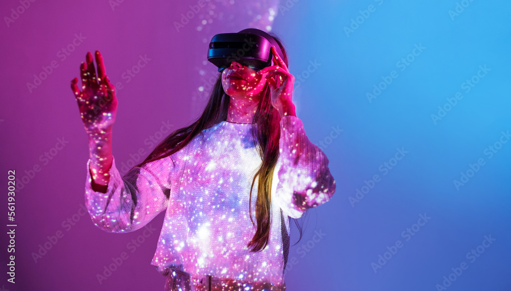 Young woman touching helmet and wearing virtual reality headset. Future digital vr technology and entertainment. Space exploration with augmented reality glasses Young woman touching helmet and wearing virtual reality headset. Future digital vr technology and entertainment. Space exploration with augmented reality glasses