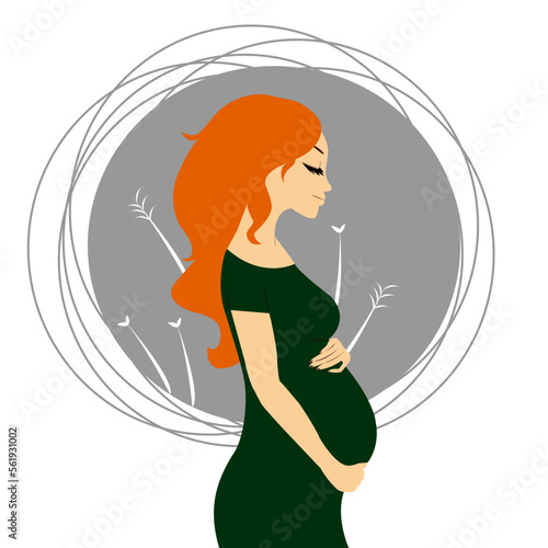 Beautiful pregnant woman with green dress hugging her tummy
