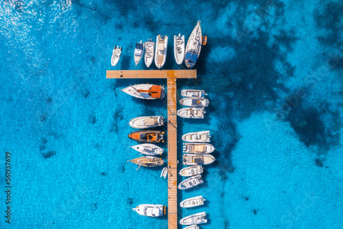 Fotografia Aerial view of boats and luxury yachts in dock at sunset in summer in Sardinia, Italy