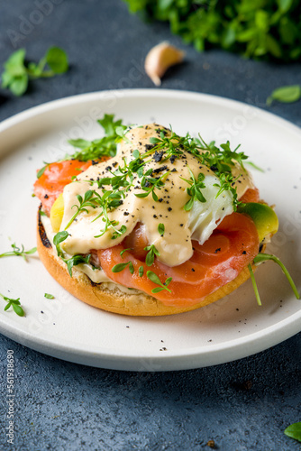 Obraz na plátně eggs Benedict with salmon and avocado on white plate