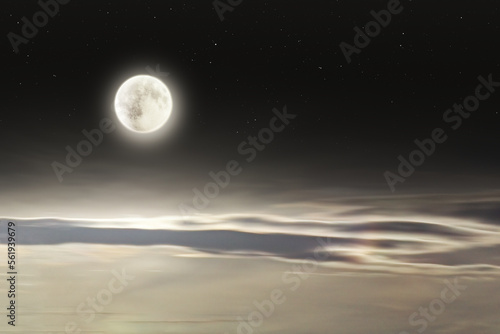 Bright full moon with soft elongated clouds and stars at night