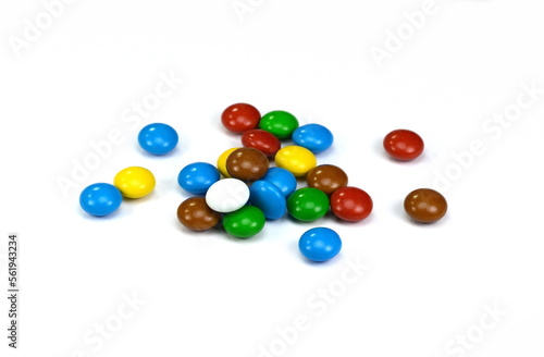 Round candies on a white background, scattered candies. Colorful round candies isolated.
