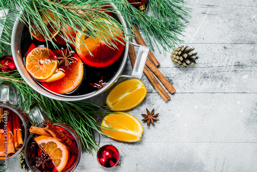 Christmas hot Mulled wine in a pot of spices and herbs.