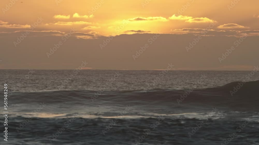 Waves of the blue sea at a yellow sunset Waves of the blue sea at a yellow sunset