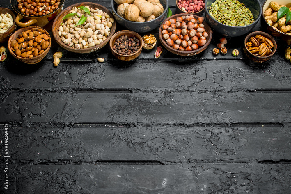 Assortment of different nuts in bowls. Assortment of different nuts in bowls.