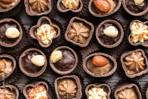 Different kinds of chocolates on colored table close-up. Top View and Flat Lay