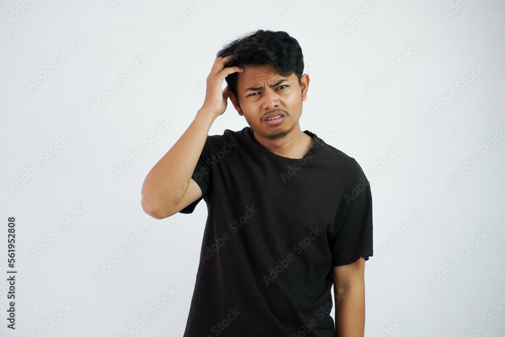 confused young asian man holding head wearing black t shirt isolated on white background confused young asian man holding head wearing black t shirt isolated on white background