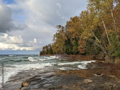 Pictured rocks under a birch and evergreen forest