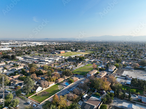 Fototapeta Naklejka Na Ścianę i Meble -  Aerial view of Ontario city in California with mountains in the background, California, USA