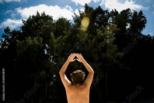 A man performs tai chi on the beach at Sherwood Forest in Waimanalo, Hawaii. photo