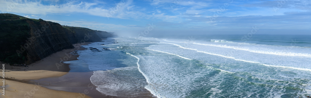 Magoito Beach during storm and high waves, beautiful sandy beach on Sintra coast, Lisbon district, Portugal, part of Sintra-Cascais Natural Park with natural points of interest
