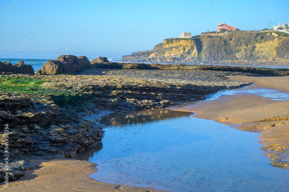 Magoito Beach, beautiful sandy beach on Sintra coast, during low tide, Lisbon district, Portugal, part of Sintra-Cascais Natural Park with natural points of interest