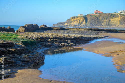 Magoito Beach, beautiful sandy beach on Sintra coast, during low tide, Lisbon district, Portugal, part of Sintra-Cascais Natural Park with natural points of interest