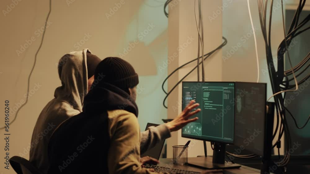 Skilled web thief hacking network with digital espionage concept, stealing important government information. Male hacker working with trojan virus to hack firewall, doing cyberattack. Skilled web thief hacking network with digital espionage concept, stealing important government information. Male hacker working with trojan virus to hack firewall, doing cyberattack.