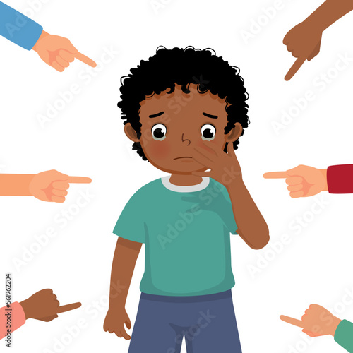 little African boy crying get bullied at school feeling sad, guilty and ashamed with finger surrounding pointing at him blaming and accusing him in public