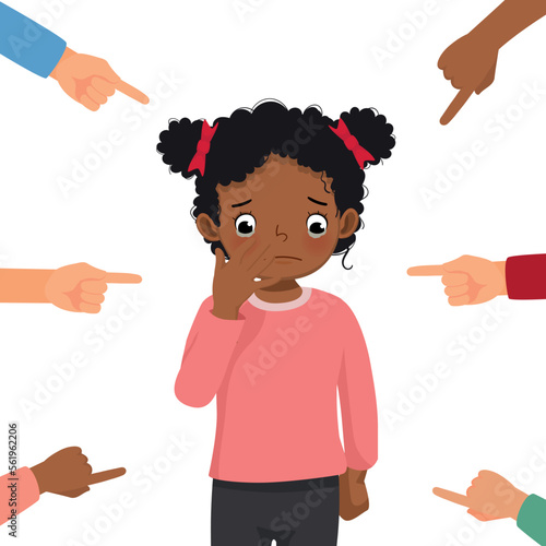 little African girl crying get bullied at school feeling sad, guilty and ashamed with finger surrounding pointing at her blaming and accusing her in public