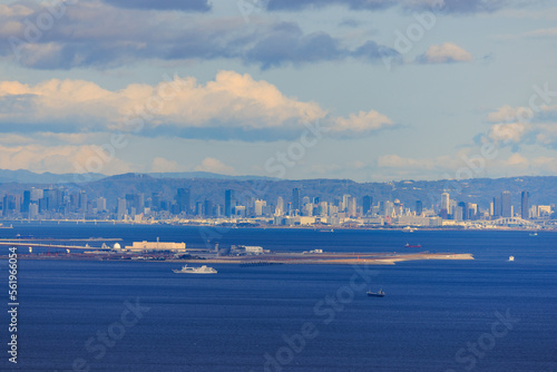 Kobe Airport on Manmade Island at Sea Level with City Skyline in Distance