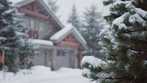 Alpine homes at the foot of Whistler Mountain, snow falling trees, winter scene, log cabin, luxury vacation home. 4K 24FPS