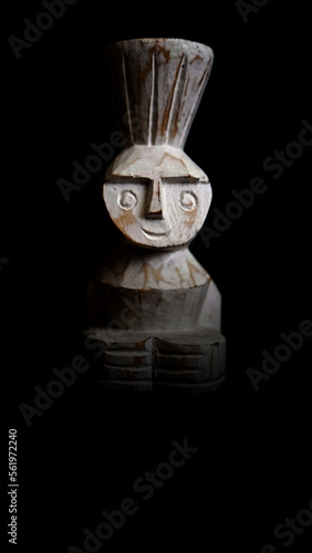 Photography High-resolution, professional-grade photo of a beautifully crafted male wooden African doll