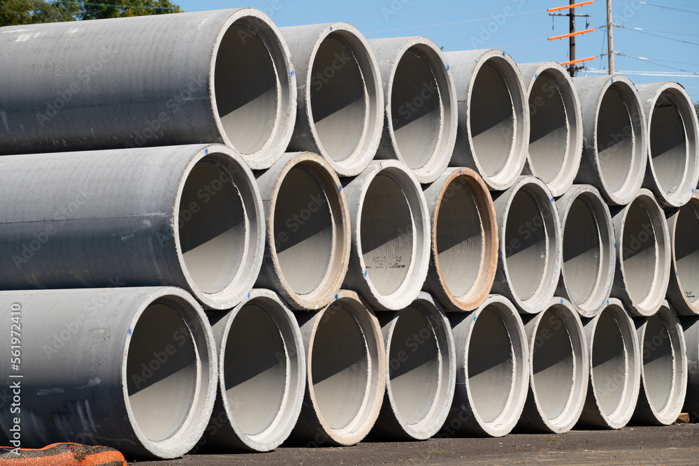 Reinforced concrete storm sewer pipes stacked at a construction site large diameter pipes Reinforced concrete storm sewer pipes stacked at a construction site large diameter pipes