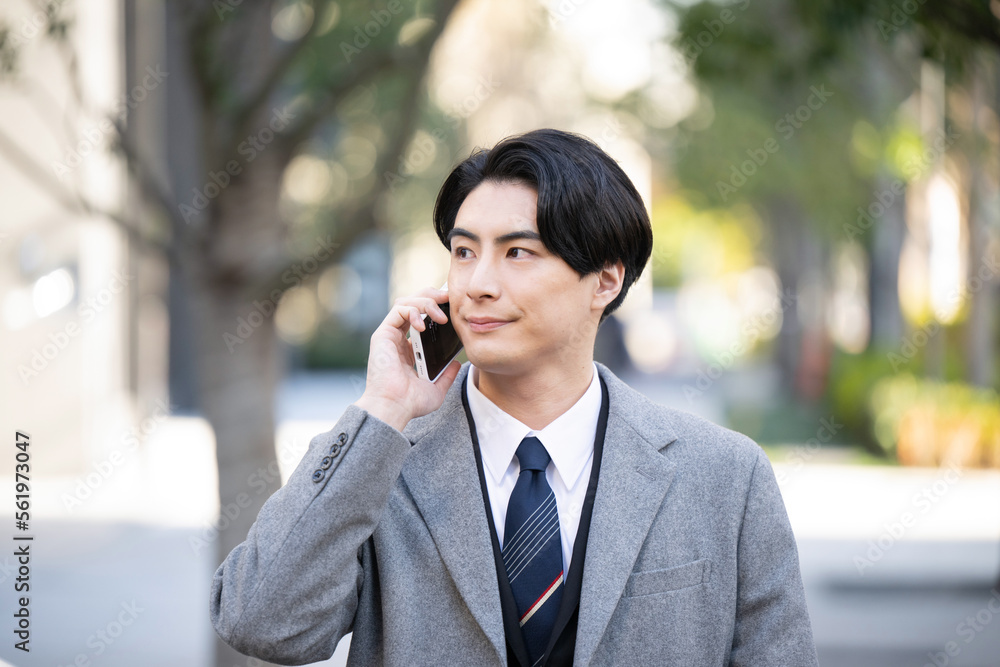 Businessman on the phone outside with space for photocopying Businessman on the phone outside with space for photocopying