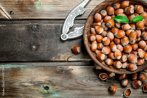 Hazelnuts in a bowl with a Nutcracker.