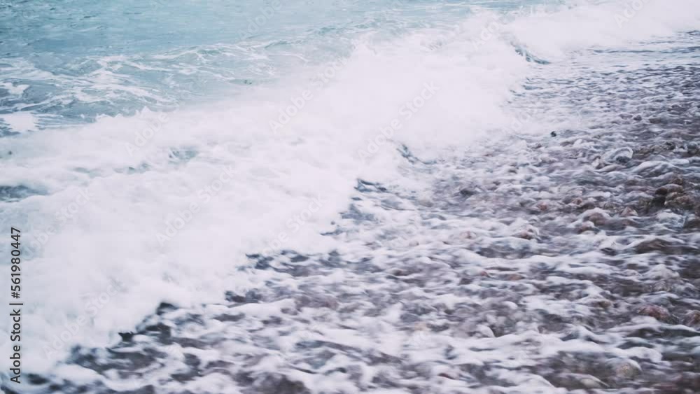 Stormy sea waves on the shore. Breaking wave line in the sea with foamy white texture
Stormy sea waves on the shore. Breaking wave line in the sea with foamy white texture