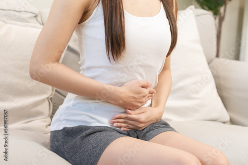 Εκτύπωση καμβά Flatulence asian young woman, girl hand in stomach ache, suffer from food poisoning, abdominal pain and colon problem, gastritis or diarrhoea
