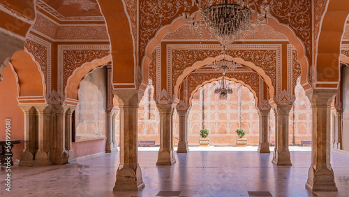 Sarvato Bhadra at Diwan-e-Khas Hall of Private Audience. Columns and openwork arches made of red sandstone are decorated with white ornaments. Chandeliers on the ceiling. India. Jaipur. City Palace photo