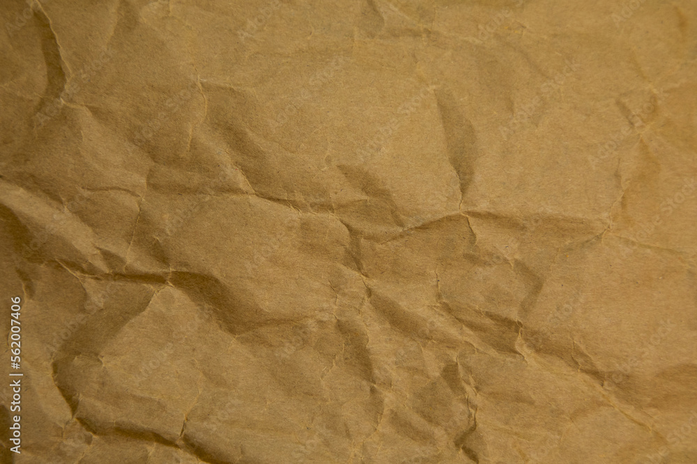 Fototapeta premium Brown wrinkle paper background texture. Brown template. Brown paper background.