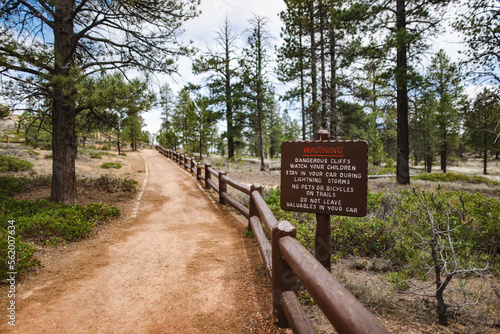 Hiking trail leading through stunning red sandstone hoodoo formations in Bryce Canyon National Park in Utah, USA.