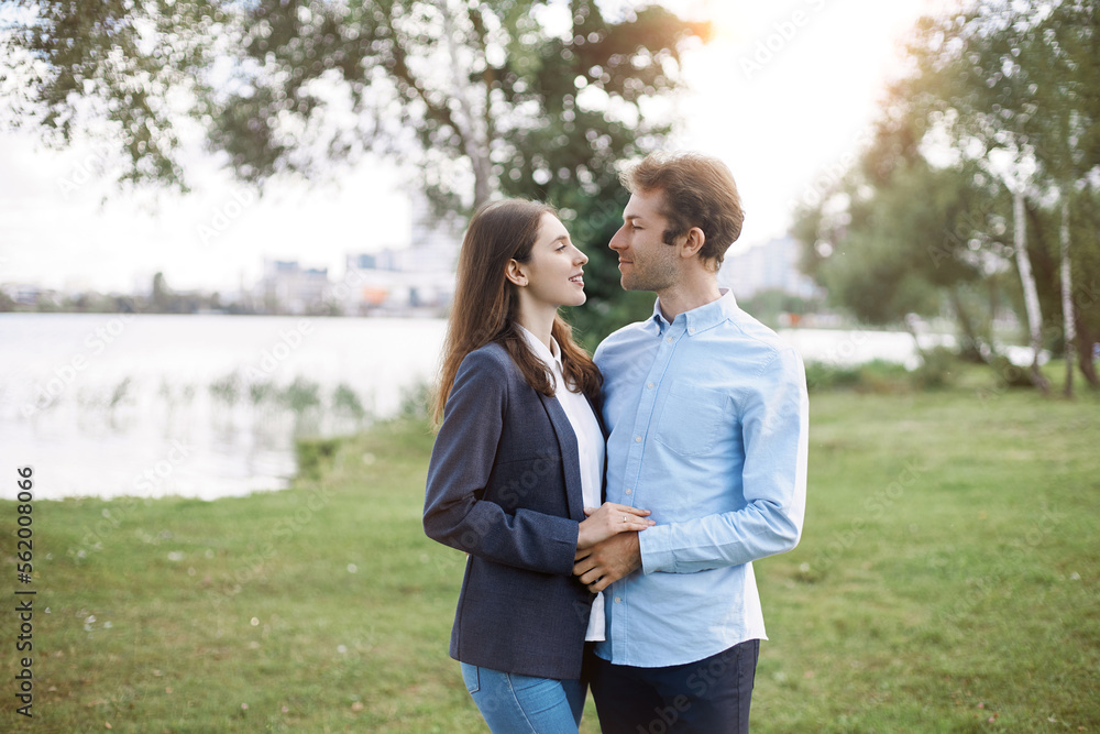 couple in love standing on the shore of the lake. couple in love standing on the shore of the lake.