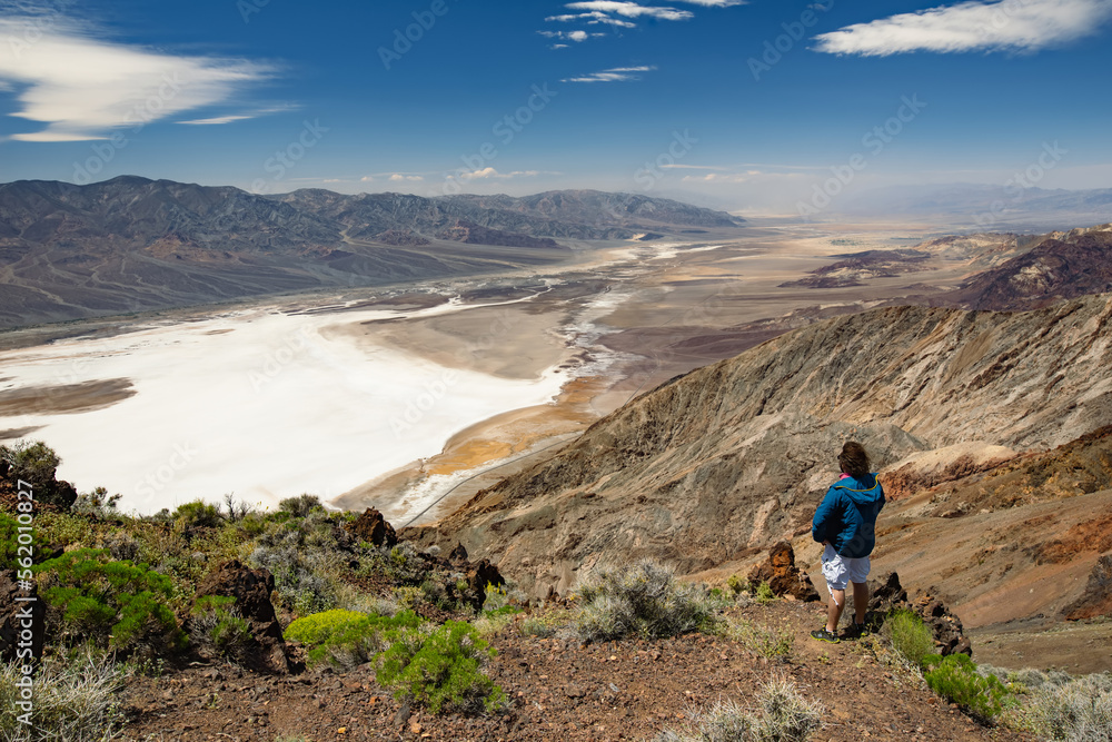 Young male hiker admiring beautiful view of Death Valley from Dante's View viewpoint, California, USA.