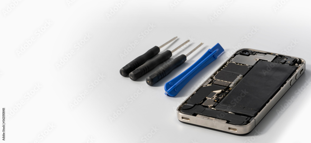 Technician repairing the Cell phone parts and tools for recovery repair phone smartphone and upgrade mobile technology, the concept of computer hardware inside. Technician repairing the Cell phone parts and tools for recovery repair phone smartphone and upgrade mobile technology, the concept of computer hardware inside.